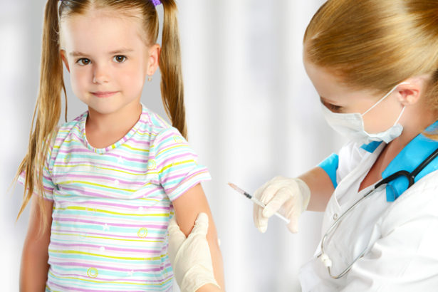 Doctor a pediatrician makes child vaccinated vaccination
